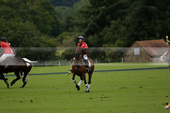 Four Quarters Black (black) v Clashleigh (red) in the Autumn Cup subsidiary final polo match on Ambersham 2 at Cowdray Park Polo Club on Sunday 22 September 2013 www.polopictures.co.uk