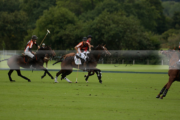 Four Quarters Black (black) v Clashleigh (red) in the Autumn Cup subsidiary final polo match on Ambersham 2 at Cowdray Park Polo Club on Sunday 22 September 2013 www.polopictures.co.uk