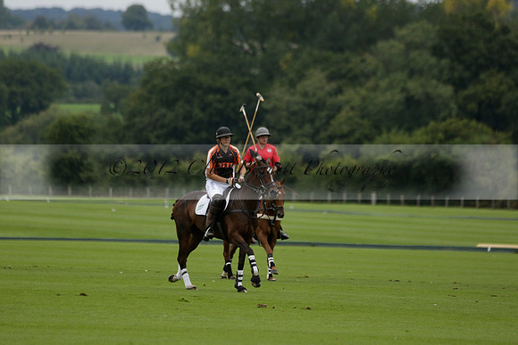 Four Quarters Black (black) v Clashleigh (red) in the Autumn Cup subsidiary final polo match on Ambersham 2 at Cowdray Park Polo Club on Sunday 22 September 2013 www.polopictures.co.uk