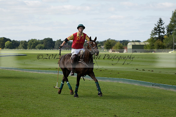 Four Quarters Black (black) v BHC (red) in a Autumn Cup polo match on Ambersham 2 at Cowdray Park Polo Club on Friday 20 September 2013 www.polopictures.co.uk