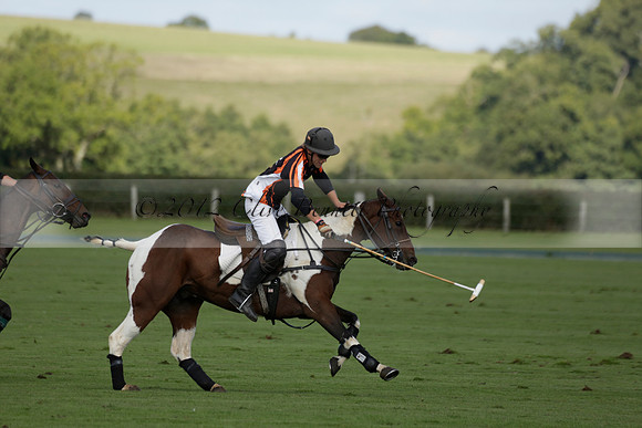 Four Quarters Black (black) v BHC (red) in a Autumn Cup polo match on Ambersham 2 at Cowdray Park Polo Club on Friday 20 September 2013 www.polopictures.co.uk
