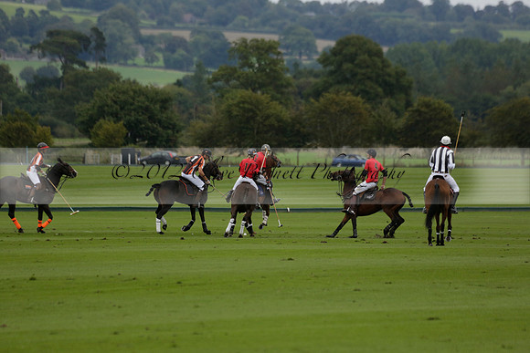 Four Quarters Black (black) v Clashleigh (red) in the Autumn Cup subsidiary final polo match on Ambersham 2 at Cowdray Park Polo Club on Sunday 22 September 2013 www.polopictures.co.uk