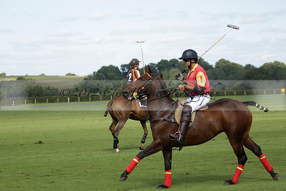 Four Quarters Black (black) v BHC (red) in a Autumn Cup polo match on Ambersham 2 at Cowdray Park Polo Club on Friday 20 September 2013 www.polopictures.co.uk
