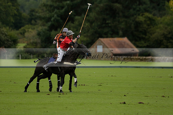Four Quarters Black (black) v Clashleigh (red) in the Autumn Cup subsidiary final polo match on Ambersham 2 at Cowdray Park Polo Club on Sunday 22 September 2013 www.polopictures.co.uk