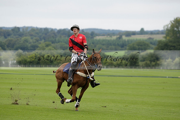 Four Quarters Black (black) v Clashleigh (red) in the Autumn Cup subsidiary final polo match on Ambersham 2 at Cowdray Park Polo Club on Sunday 22 September 2013 www.polopictures.co.uk