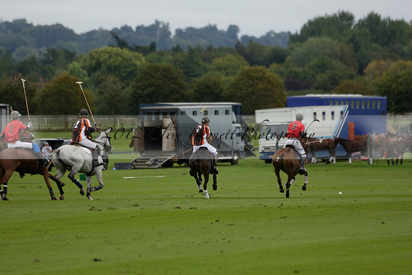 Four Quarters Black (black) v Clashleigh (red) in the Autumn Cup subsidiary final polo match on Ambersham 2 at Cowdray Park Polo Club on Sunday 22 September 2013 www.polopictures.co.uk