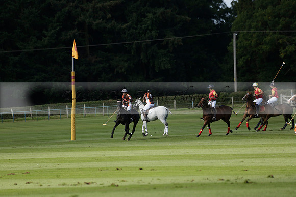 Four Quarters Black (black) v BHC (red) in a Autumn Cup polo match on Ambersham 2 at Cowdray Park Polo Club on Friday 20 September 2013 www.polopictures.co.uk