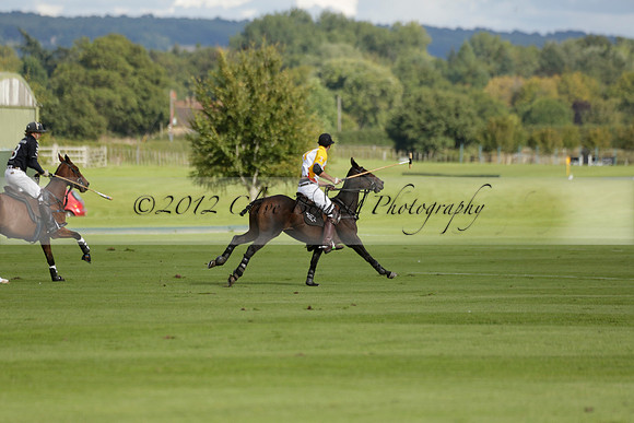 Aryana (black) v Shoreline (yellow) in a Farewell Cup polo match played on Ambersham 5 at Cowdray Park Polo Club on Wednesday 18 September 2013. www.polopictures.co.uk