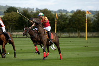 Four Quarters Black (black) v BHC (red) in a Autumn Cup polo match on Ambersham 2 at Cowdray Park Polo Club on Friday 20 September 2013 www.polopictures.co.uk