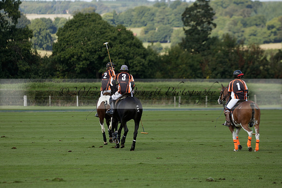 Four Quarters Black (black) v BHC (red) in a Autumn Cup polo match on Ambersham 2 at Cowdray Park Polo Club on Friday 20 September 2013 www.polopictures.co.uk