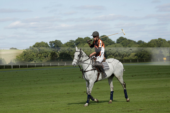 Four Quarters Black (black) v BHC (red) in a Autumn Cup polo match on Ambersham 2 at Cowdray Park Polo Club on Friday 20 September 2013 www.polopictures.co.uk