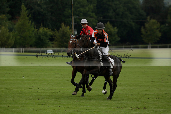 Four Quarters Black (black) v Clashleigh (red)in a Jaeger Le Coultre Autumn Cup polo match played on Ambersham 2 at Cowdray Park Polo Club on Wednesday 2013.09.11 www.polopictures.co.uk