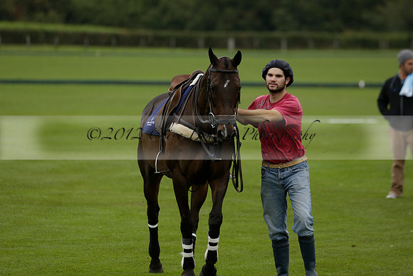 Four Quarters Black (black) v Clashleigh (red) in the Autumn Cup subsidiary final polo match on Ambersham 2 at Cowdray Park Polo Club on Sunday 22 September 2013 www.polopictures.co.uk
