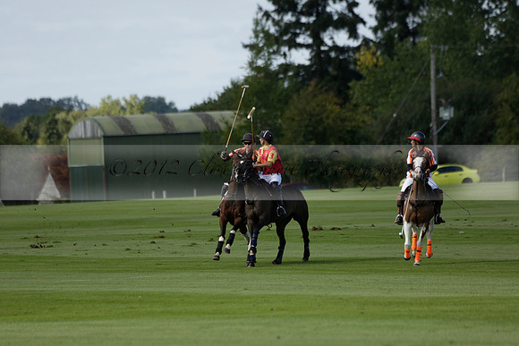 Four Quarters Black (black) v BHC (red) in a Autumn Cup polo match on Ambersham 2 at Cowdray Park Polo Club on Friday 20 September 2013 www.polopictures.co.uk