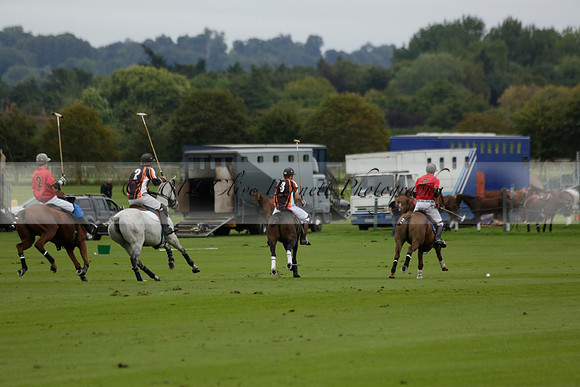 Four Quarters Black (black) v Clashleigh (red) in the Autumn Cup subsidiary final polo match on Ambersham 2 at Cowdray Park Polo Club on Sunday 22 September 2013 www.polopictures.co.uk