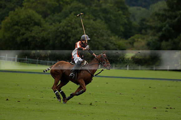 Four Quarters Black (black) v Clashleigh (red) in the Autumn Cup subsidiary final polo match on Ambersham 2 at Cowdray Park Polo Club on Sunday 22 September 2013 www.polopictures.co.uk