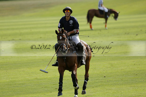 Pandas (white) v Home Farm (navy) in a Park House West Sussex Cup Polo match on Brooksfield at Cowdray Park Polo Club on Friday 30 August 2013. 2013.08.30 www.polopictures.co.uk