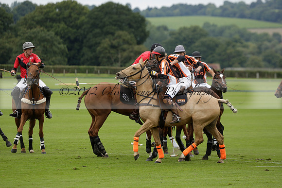 Four Quarters Black (black) v Clashleigh (red) in the Autumn Cup subsidiary final polo match on Ambersham 2 at Cowdray Park Polo Club on Sunday 22 September 2013 www.polopictures.co.uk