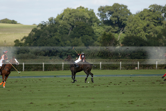 Four Quarters Black (black) v BHC (red) in a Autumn Cup polo match on Ambersham 2 at Cowdray Park Polo Club on Friday 20 September 2013 www.polopictures.co.uk