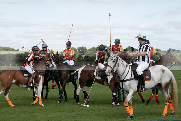 Four Quarters Black (black) v BHC (red) in a Autumn Cup polo match on Ambersham 2 at Cowdray Park Polo Club on Friday 20 September 2013 www.polopictures.co.uk