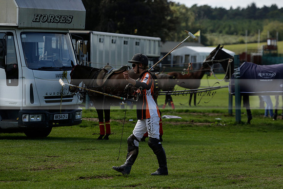 Four Quarters Black (black) v BHC (red) in a Autumn Cup polo match on Ambersham 2 at Cowdray Park Polo Club on Friday 20 September 2013 www.polopictures.co.uk