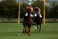 Four Quarters Black (black) v BHC (red) in a Autumn Cup polo match on Ambersham 2 at Cowdray Park Polo Club on Friday 20 September 2013 www.polopictures.co.uk