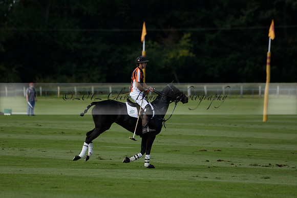 Four Quarters Black (black) v BHC (red) in a Autumn Cup polo match on Ambersham 2 at Cowdray Park Polo Club on Friday 20 September 2013 www.polopictures.co.uk