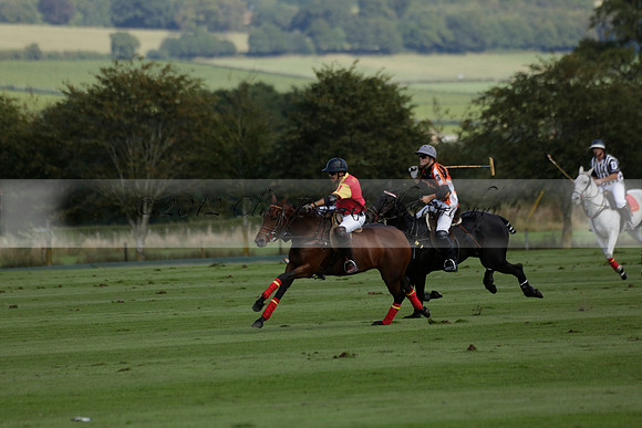 Four Quarters Black (black) v BHC (red) in a Autumn Cup polo match on Ambersham 2 at Cowdray Park Polo Club on Friday 20 September 2013 www.polopictures.co.uk