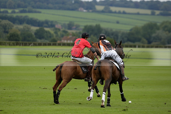 Four Quarters Black (black) v Clashleigh (red) in the Autumn Cup subsidiary final polo match on Ambersham 2 at Cowdray Park Polo Club on Sunday 22 September 2013 www.polopictures.co.uk