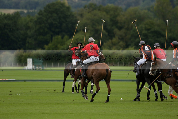 Four Quarters Black (black) v Clashleigh (red) in the Autumn Cup subsidiary final polo match on Ambersham 2 at Cowdray Park Polo Club on Sunday 22 September 2013 www.polopictures.co.uk
