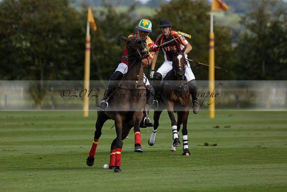Four Quarters Black (black) v BHC (red) in a Autumn Cup polo match on Ambersham 2 at Cowdray Park Polo Club on Friday 20 September 2013 www.polopictures.co.uk