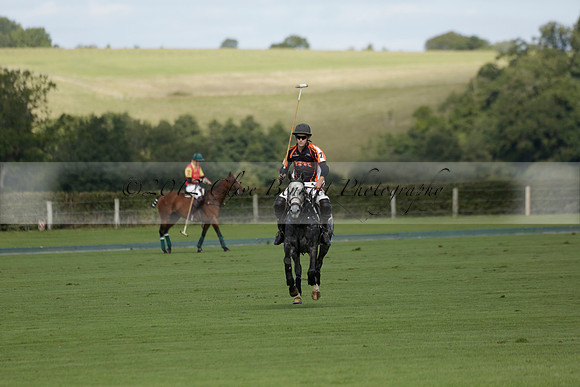 Four Quarters Black (black) v BHC (red) in a Autumn Cup polo match on Ambersham 2 at Cowdray Park Polo Club on Friday 20 September 2013 www.polopictures.co.uk