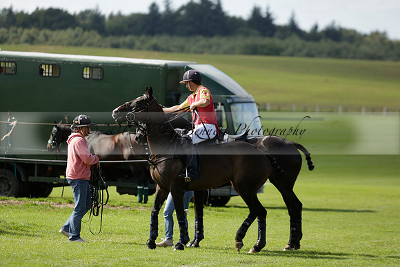 Four Quarters Black (black) v BHC (red) in a Autumn Cup polo match on Ambersham 2 at Cowdray Park Polo Club on Friday 20 September 2013 www.polopictures.co.uk