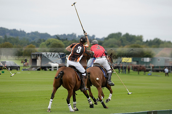 Four Quarters Black (black) v Clashleigh (red) in the Autumn Cup subsidiary final polo match on Ambersham 2 at Cowdray Park Polo Club on Sunday 22 September 2013 www.polopictures.co.uk