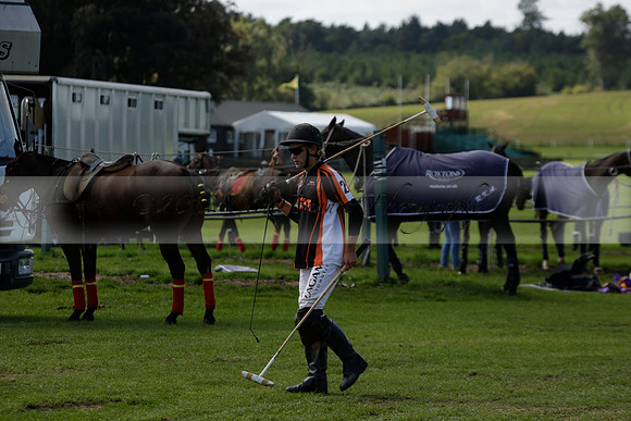 Four Quarters Black (black) v BHC (red) in a Autumn Cup polo match on Ambersham 2 at Cowdray Park Polo Club on Friday 20 September 2013 www.polopictures.co.uk
