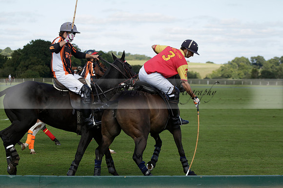 Four Quarters Black (black) v BHC (red) in a Autumn Cup polo match on Ambersham 2 at Cowdray Park Polo Club on Friday 20 September 2013 www.polopictures.co.uk
