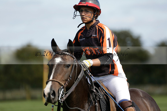 Four Quarters Black (black) v BHC (red) in a Autumn Cup polo match on Ambersham 2 at Cowdray Park Polo Club on Friday 20 September 2013 www.polopictures.co.uk