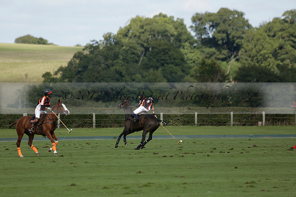 Four Quarters Black (black) v BHC (red) in a Autumn Cup polo match on Ambersham 2 at Cowdray Park Polo Club on Friday 20 September 2013 www.polopictures.co.uk