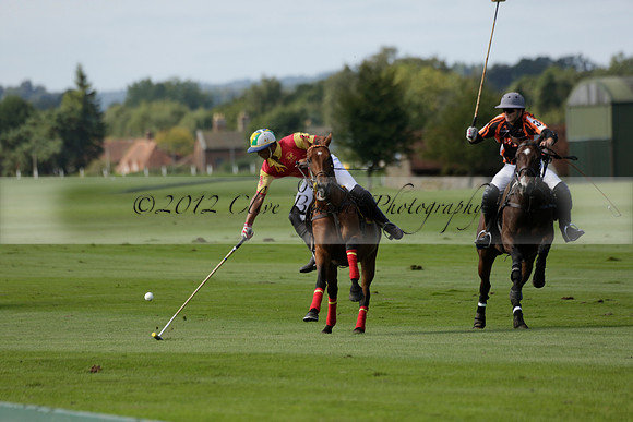 Four Quarters Black (black) v BHC (red) in a Autumn Cup polo match on Ambersham 2 at Cowdray Park Polo Club on Friday 20 September 2013 www.polopictures.co.uk