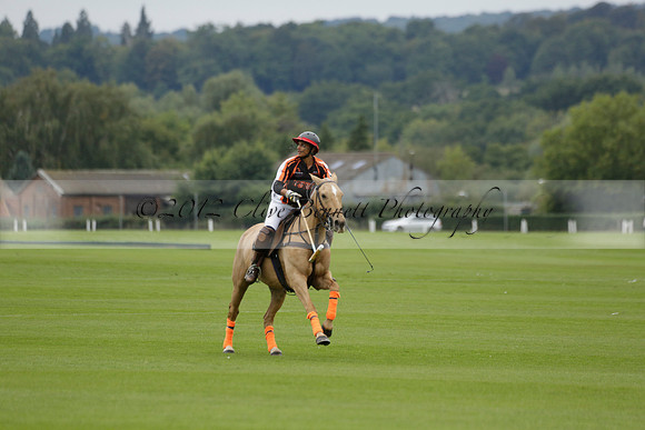 Four Quarters Black (black) v Clashleigh (red) in the Autumn Cup subsidiary final polo match on Ambersham 2 at Cowdray Park Polo Club on Sunday 22 September 2013 www.polopictures.co.uk
