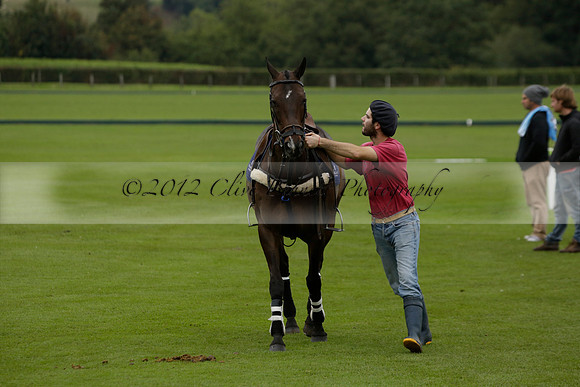 Four Quarters Black (black) v Clashleigh (red) in the Autumn Cup subsidiary final polo match on Ambersham 2 at Cowdray Park Polo Club on Sunday 22 September 2013 www.polopictures.co.uk