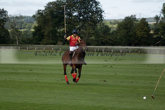 Four Quarters Black (black) v BHC (red) in a Autumn Cup polo match on Ambersham 2 at Cowdray Park Polo Club on Friday 20 September 2013 www.polopictures.co.uk
