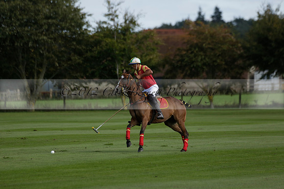 Four Quarters Black (black) v BHC (red) in a Autumn Cup polo match on Ambersham 2 at Cowdray Park Polo Club on Friday 20 September 2013 www.polopictures.co.uk