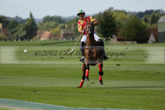 Four Quarters Black (black) v BHC (red) in a Autumn Cup polo match on Ambersham 2 at Cowdray Park Polo Club on Friday 20 September 2013 www.polopictures.co.uk