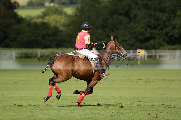 Four Quarters Black (black) v BHC (red) in a Autumn Cup polo match on Ambersham 2 at Cowdray Park Polo Club on Friday 20 September 2013 www.polopictures.co.uk