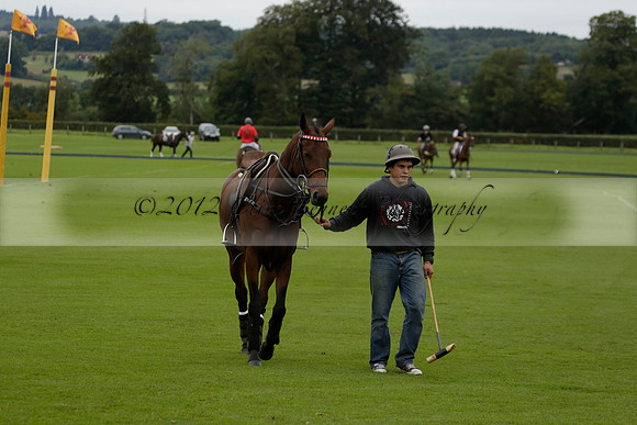Four Quarters Black (black) v Clashleigh (red) in the Autumn Cup subsidiary final polo match on Ambersham 2 at Cowdray Park Polo Club on Sunday 22 September 2013 www.polopictures.co.uk