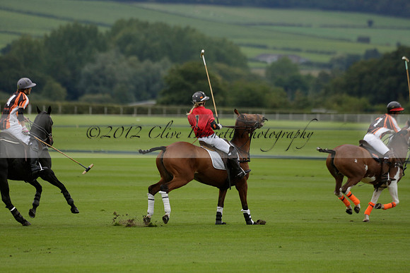 Four Quarters Black (black) v Clashleigh (red) in the Autumn Cup subsidiary final polo match on Ambersham 2 at Cowdray Park Polo Club on Sunday 22 September 2013 www.polopictures.co.uk