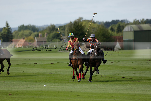 Four Quarters Black (black) v BHC (red) in a Autumn Cup polo match on Ambersham 2 at Cowdray Park Polo Club on Friday 20 September 2013 www.polopictures.co.uk