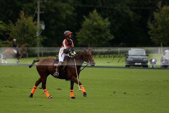 Four Quarters Black (black) v Clashleigh (red) in the Autumn Cup subsidiary final polo match on Ambersham 2 at Cowdray Park Polo Club on Sunday 22 September 2013 www.polopictures.co.uk