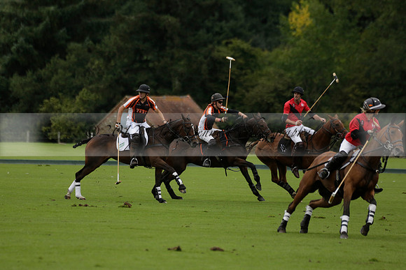 Four Quarters Black (black) v Clashleigh (red) in the Autumn Cup subsidiary final polo match on Ambersham 2 at Cowdray Park Polo Club on Sunday 22 September 2013 www.polopictures.co.uk